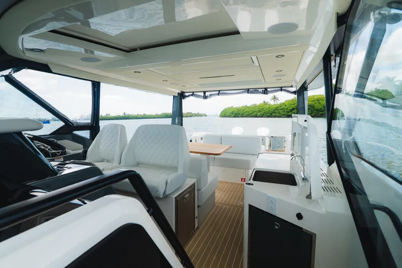 La Plage Yacht Photos Pics Interior of 2024 Saxdor 400 GTO yacht with luxurious seating and scenic water view.
