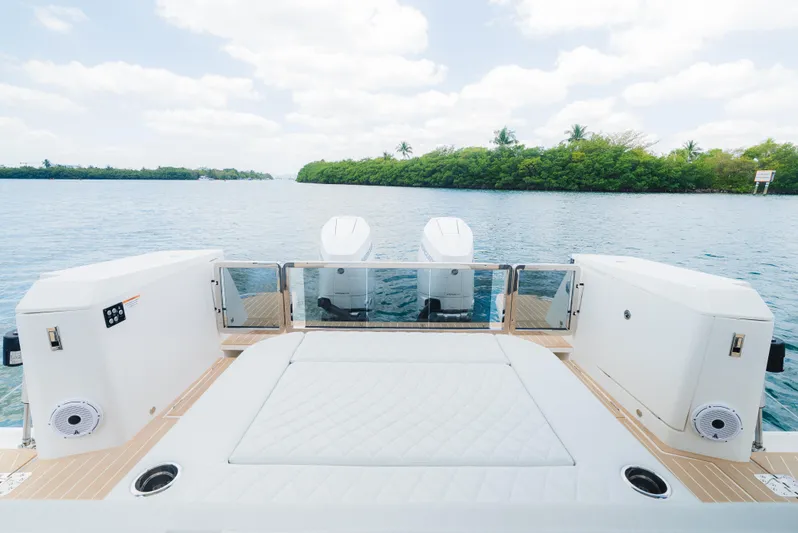 La Plage Yacht Photos Pics 2024 Saxdor 400 GTO boat deck with dual engines on a serene waterway.
