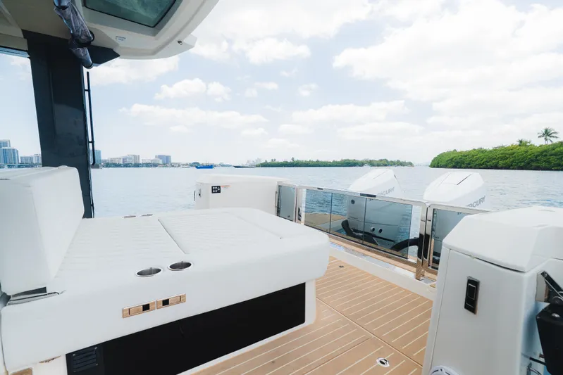 La Plage Yacht Photos Pics 2024 Saxdor 400 GTO boat interior with white seating and scenic water view.