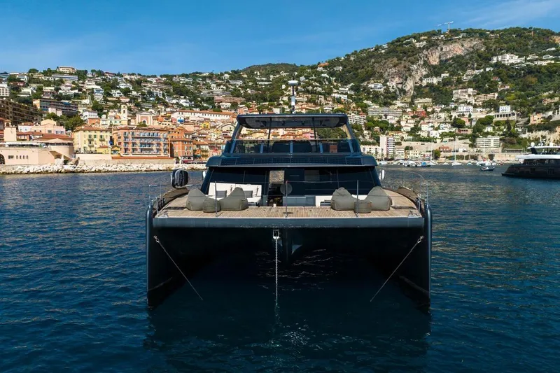 Double Happiness Yacht Photos Pics 2024 Sunreef 60 Sunreef Power Eco yacht in scenic coastal harbor.