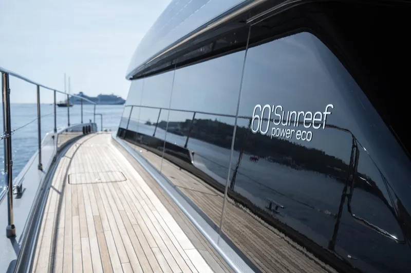 Double Happiness Yacht Photos Pics 2024 Sunreef 60 Power Eco yacht with sleek design and wooden deck.