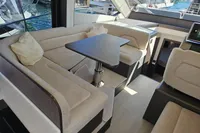 Luxurious interior of 2025 Galeon 480 Fly yacht with plush seating and modern design.