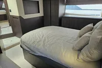 Luxurious bedroom interior of 2025 Galeon 480 Fly yacht with modern design.