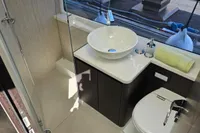 Modern bathroom in 2025 Galeon 480 Fly yacht with sleek fixtures and glass shower.