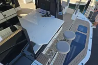 2025 Galeon 480 Fly yacht deck with seating and table, showcasing modern design and luxury.