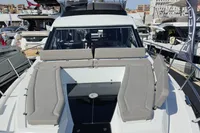 2025 Galeon 480 Fly yacht with sleek design and spacious deck at a marina.