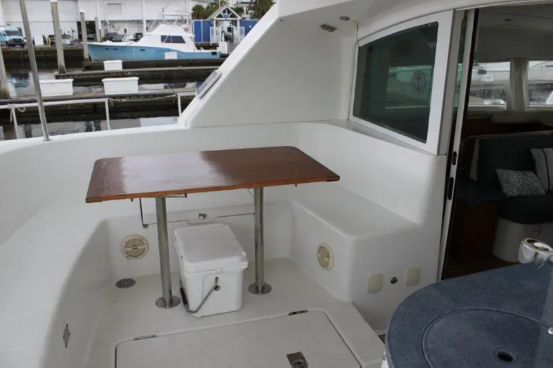 Mangata Yacht Photos Pics 2003 Lagoon 43 PC yacht interior with table and seating area.