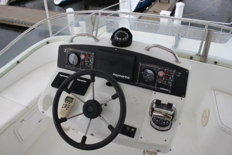 Mangata Yacht Photos Pics Cockpit of 2003 Lagoon 43 PC with steering wheel and navigation controls.