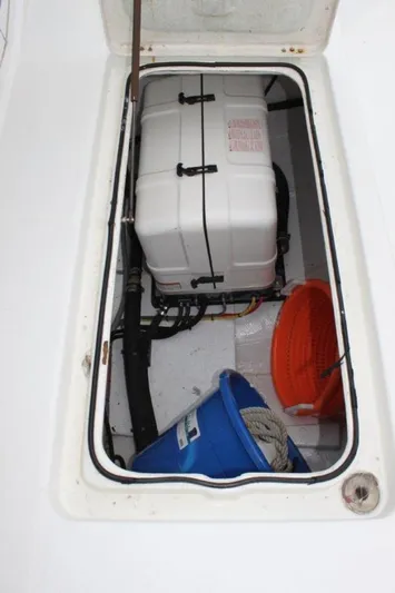 Mangata Yacht Photos Pics Storage compartment on 2003 Lagoon 43 PC boat with equipment and buckets.