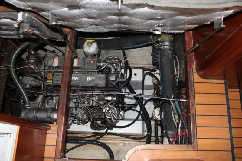 Mangata Yacht Photos Pics Engine compartment of a 2003 Lagoon 43 PC boat, showing mechanical components and wiring.