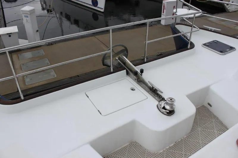 Mangata Yacht Photos Pics Deck view of 2003 Lagoon 43 PC yacht with railing and winch.