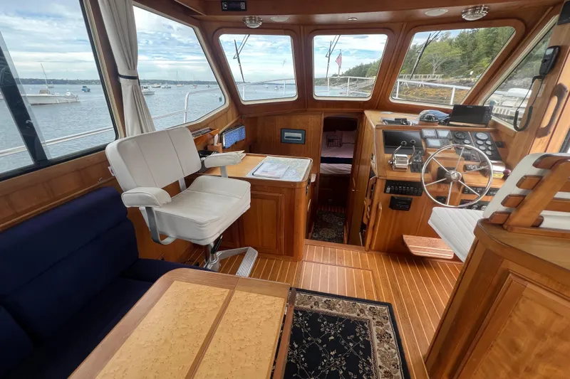Semper Fi Yacht Photos Pics 2004 Sabre 36 Hardtop Sedan interior with wood finish and nautical controls.