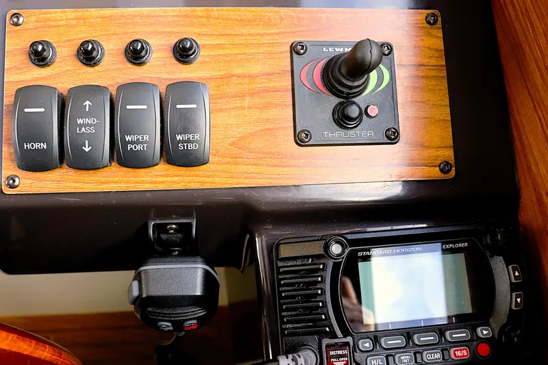 Tail Finn Yacht Photos Pics Control panel of 2021 Ranger Tugs R-27 with switches and thruster joystick.