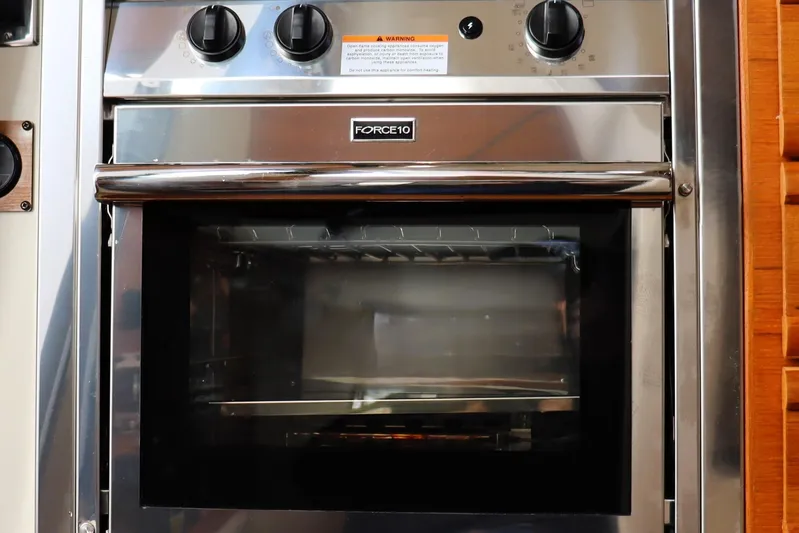 Tail Finn Yacht Photos Pics Stainless steel oven in 2021 Ranger Tugs R-27 boat kitchen.