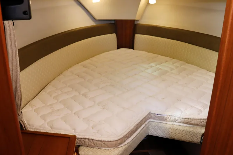 Tail Finn Yacht Photos Pics Cozy cabin bed in 2021 Ranger Tugs R-27 boat interior.