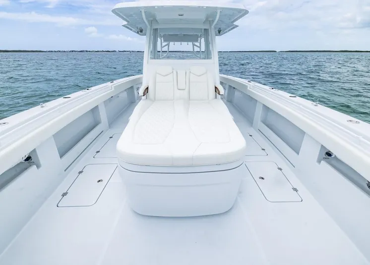  Yacht Photos Pics 2026 Invincible 40 Catamaran with white seating, cruising on open water.