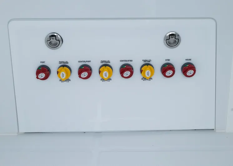  Yacht Photos Pics Control panel of 2026 Invincible 40 Catamaran with labeled switches and locks.