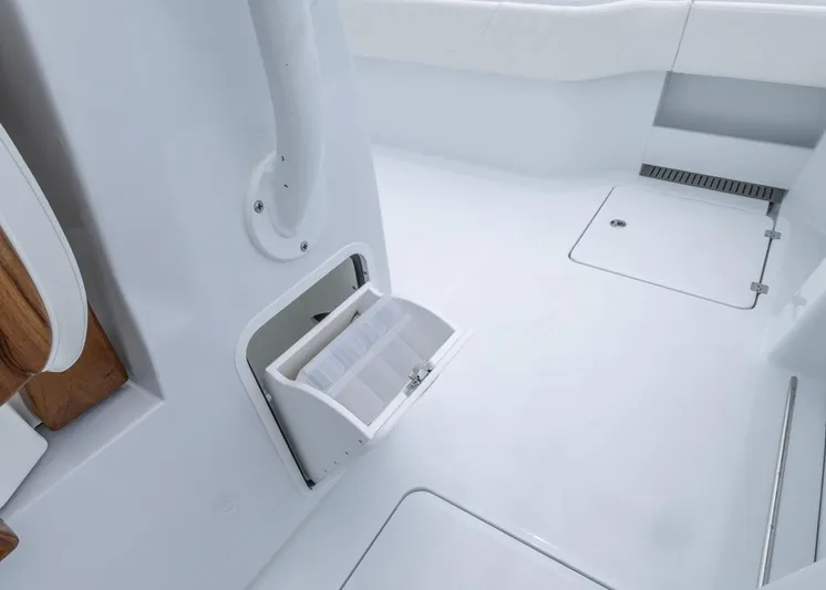  Yacht Photos Pics Interior of 2026 Invincible 40 Catamaran with storage compartment and sleek white design.