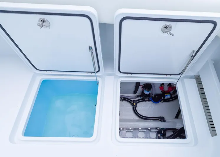  Yacht Photos Pics Open compartments on 2026 Invincible 40 Catamaran, showing storage and mechanical systems.