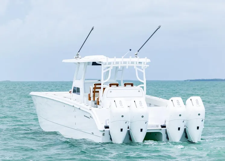  Yacht Photos Pics 2026 Invincible 40 Catamaran with quad engines on open sea.