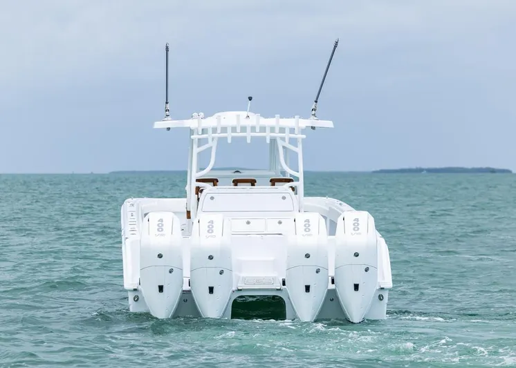  Yacht Photos Pics Invincible 40 Catamaran 2026 on open water, rear view with four engines.