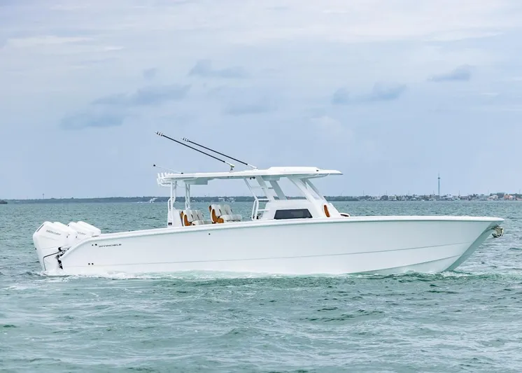  Yacht Photos Pics 2026 Invincible 40 Catamaran cruising on open water, showcasing sleek design and powerful engines.