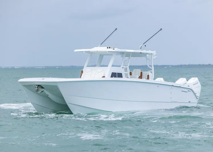  Yacht Photos Pics 2026 Invincible 40 Catamaran cruising on open water.