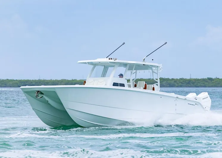  Yacht Photos Pics 2026 Invincible 40 Catamaran cruising on open water, showcasing sleek design and performance.