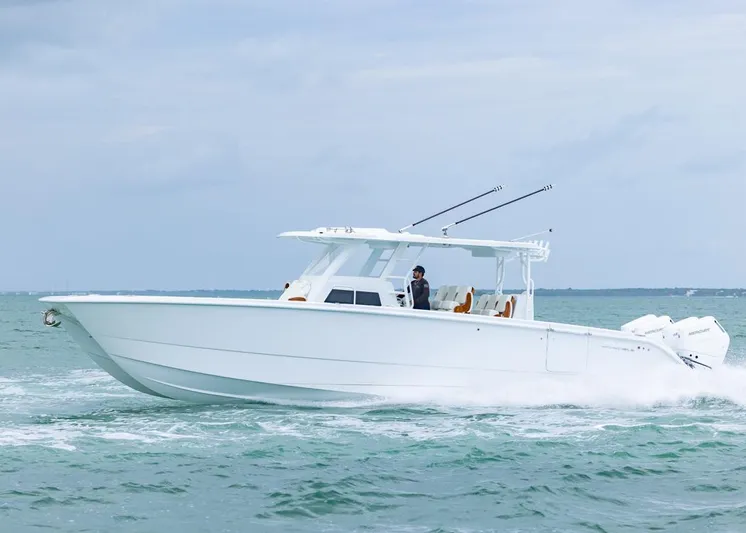  Yacht Photos Pics 2026 Invincible 40 Catamaran cruising on open water, showcasing sleek design and powerful engines.