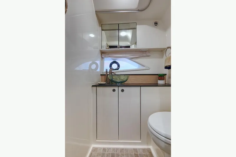  Yacht Photos Pics Manufacturer Provided Image: 2025 Sea Ray Sundancer 320 bathroom with modern fixtures and compact design.
