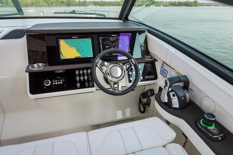  Yacht Photos Pics Manufacturer Provided Image: 2025 Sea Ray Sundancer 320 helm with advanced navigation displays and controls.