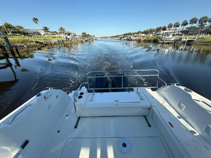  Yacht Photos Pics 2020 Beneteau Antares 9 OB cruising on a calm, scenic waterway.