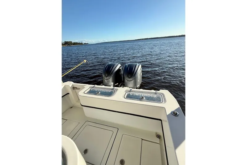  Yacht Photos Pics 2023 Contender 30 Tournament boat with dual engines on open water.