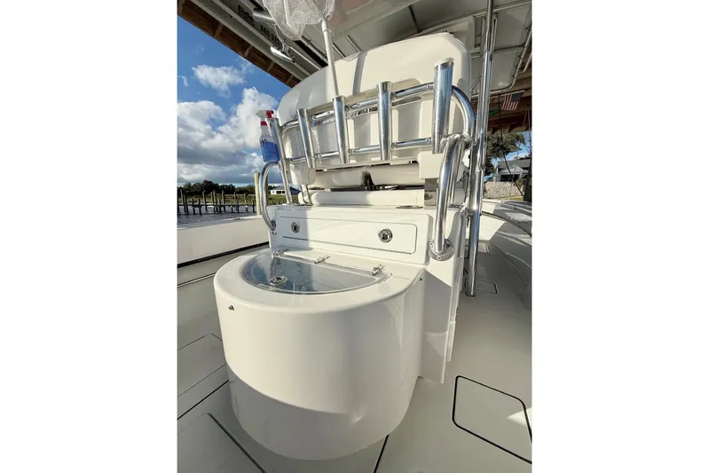  Yacht Photos Pics 2023 Contender 30 Tournament boat interior with fishing rod holders and storage.