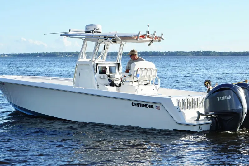  Yacht Photos Pics 2023 Contender 30 Tournament boat with Yamaha engines on open water.