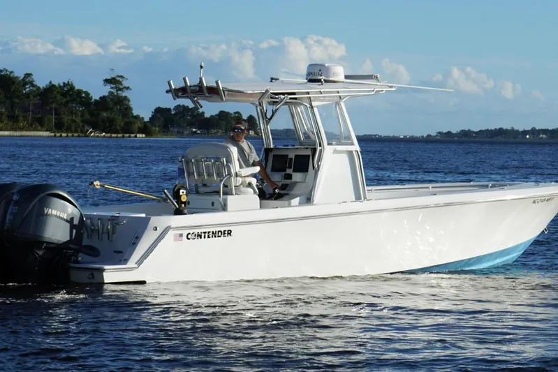  Yacht Photos Pics 2023 Contender 30 Tournament boat cruising on a sunny day with Yamaha engines.