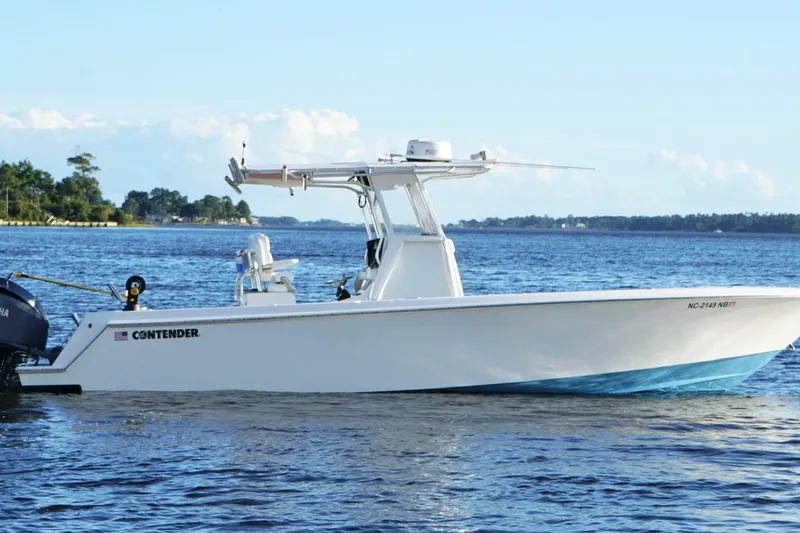  Yacht Photos Pics 2023 Contender 30 Tournament boat on calm water, side view.
