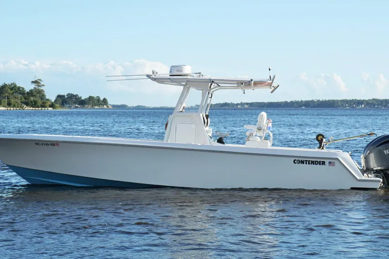  Yacht Photos Pics 2023 Contender 30 Tournament boat on calm water, side view.