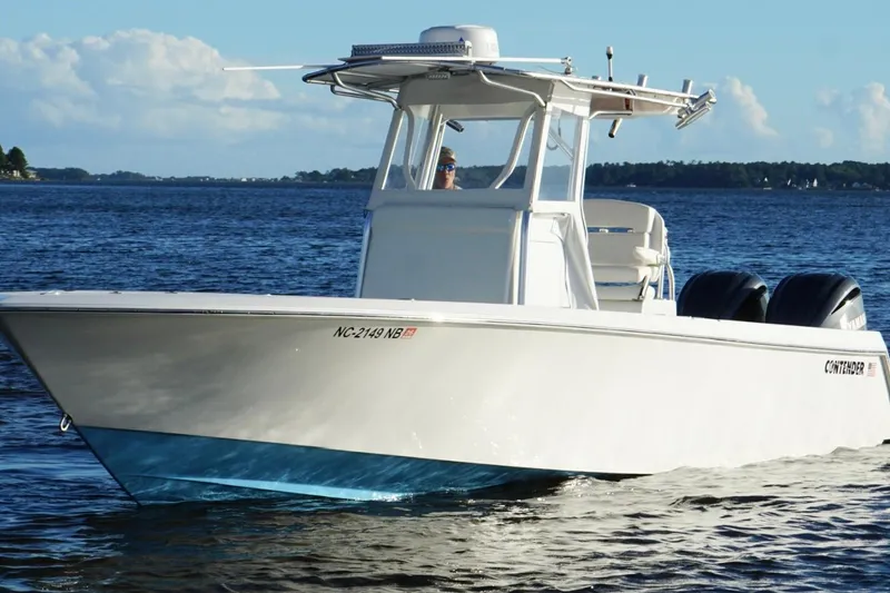  Yacht Photos Pics 2023 Contender 30 Tournament boat cruising on open water.