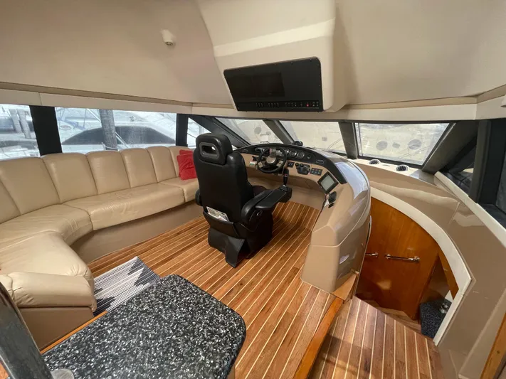  Yacht Photos Pics Luxurious 2000 Carver 530 Voyager Pilothouse interior with leather seating and modern helm.