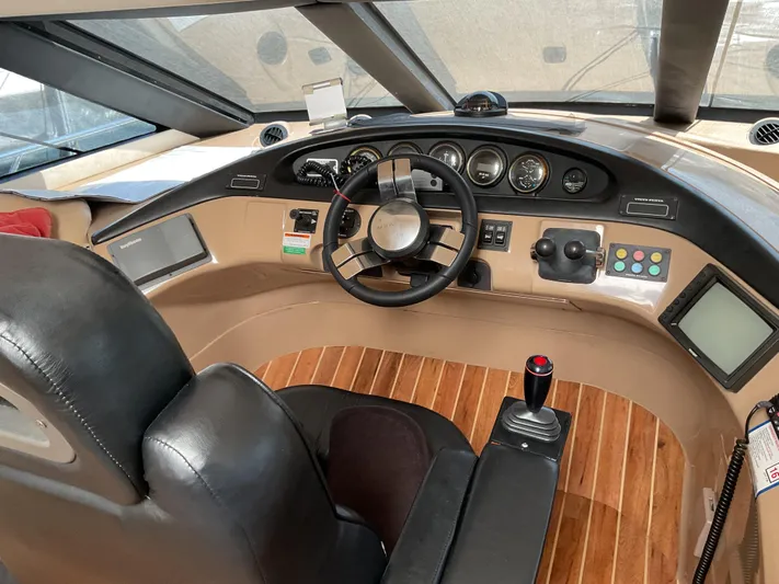  Yacht Photos Pics Pilothouse interior of 2000 Carver 530 Voyager, featuring steering wheel and control panel.