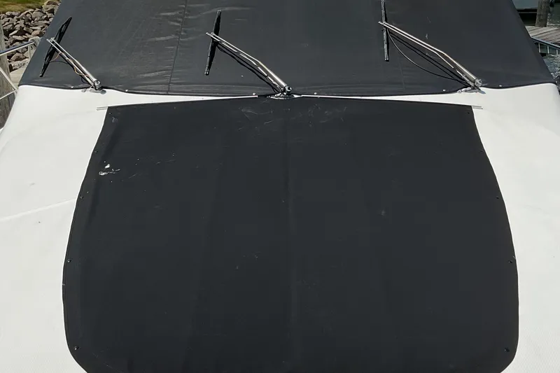  Yacht Photos Pics 2000 Carver 530 Voyager Pilothouse with black canvas cover and windshield wipers.