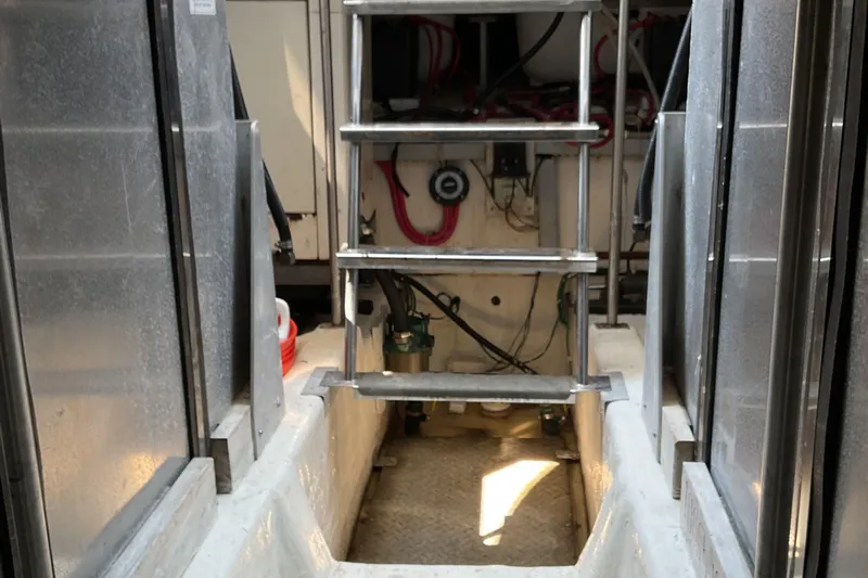  Yacht Photos Pics Engine room of 2000 Carver 530 Voyager Pilothouse with ladder and equipment.