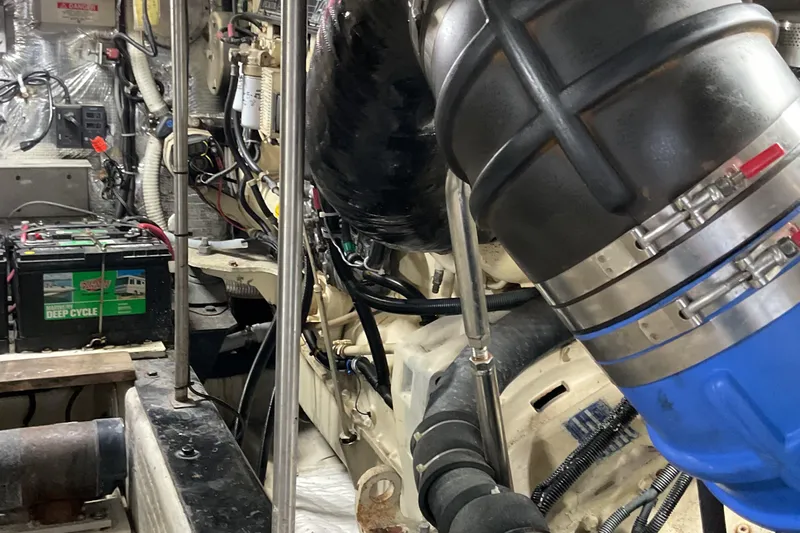  Yacht Photos Pics Engine room of 2000 Carver 530 Voyager Pilothouse with visible deep cycle battery.