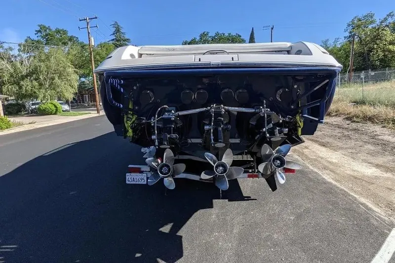  Yacht Photos Pics Rear view of a 2000 Donzi Daytona 45 boat with triple propellers.