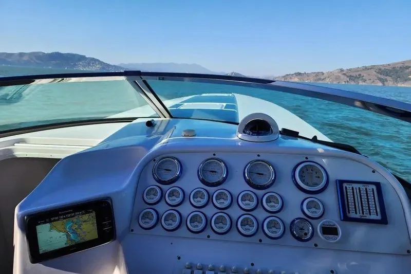  Yacht Photos Pics Cockpit view of 2000 Donzi Daytona 45 boat with gauges and navigation system.
