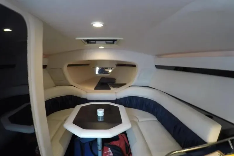  Yacht Photos Pics Interior of 2000 Donzi Daytona 45 boat with seating and table.