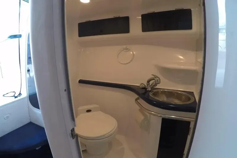  Yacht Photos Pics Interior of 2000 Donzi Daytona 45 boat bathroom with toilet and sink.