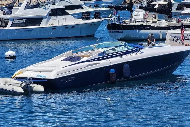  Yacht Photos Pics 2000 Donzi Daytona 45 boat docked in a marina, surrounded by other vessels.