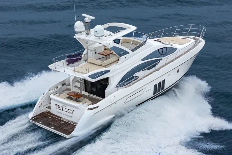  Yacht Photos Pics 2017 Azimut 54 Flybridge yacht cruising on open water, showcasing sleek design and luxury features.